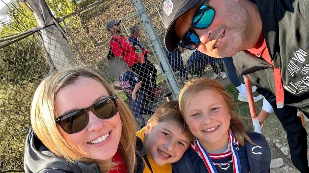 Jennifer Sakowski and her family together after a softball game, highlighting family time and work-life balance.