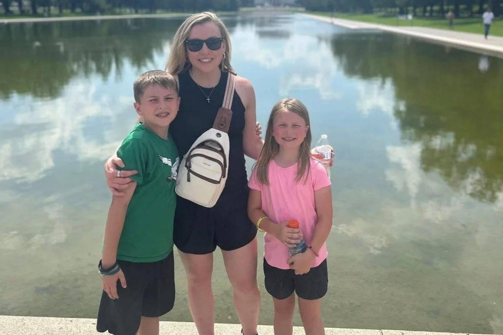 Jennifer Sakowski with her children visiting Washington, DC, spending family time together in front of a Washington, DC landmark.