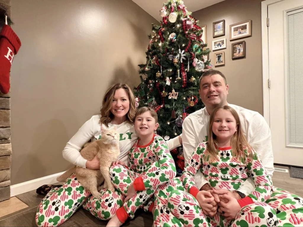 Jennifer Sakowski and her family gathered around a Christmas tree during the holiday season.