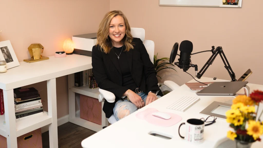 Business Strategist Jennifer Sakowski sits in her office chair as she plans coaching sessions with clients