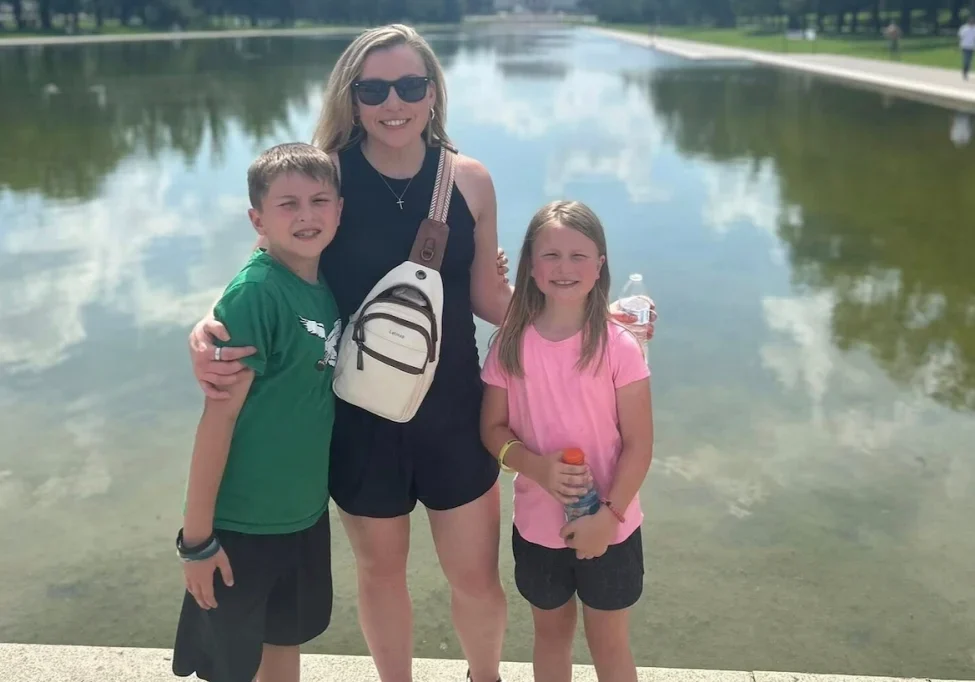Jennifer Sakowski with her children visiting Washington, DC, spending family time together in front of a Washington, DC landmark.